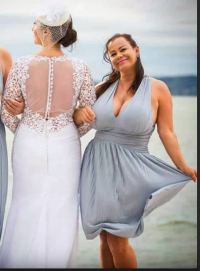 Bride gives up on being in picture since maid of honor was too busty and took all of the atten...png