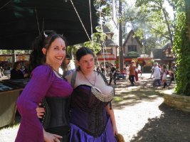 Brunette Busty Babe in a Renaissance Fest Outfit Showing Big Cleavage posing with a Friend.jpg