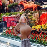 Busty Heart in a Big Beige Sweater and Skirt posing at Bellagio Hotel in Las Vegas.jpg