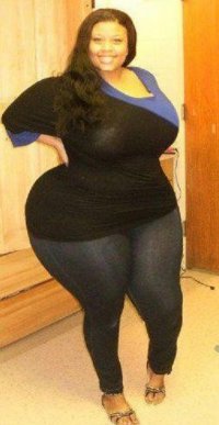 Black Busty Big Butt Hourglass Beauty with Massive Hips and Thighs in a Black and Blue Top and...jpg