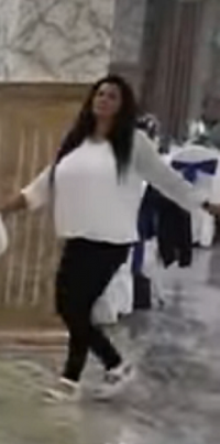 Brunette Super Busty MILF Beauty in a Baggy White Top and Black Pants with White Heels Dancing...png