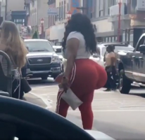 Black Lady with a Monster Huge Booty in a White Top and Red and White Striped Sweats with Blac...png